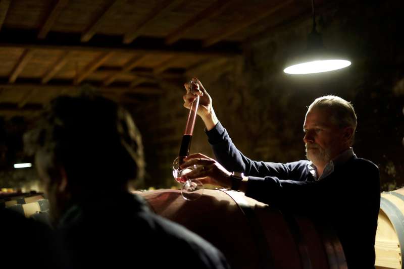 Louis Mitjavile pouring samples of Tertre Roteboeuf 2018 from barrel
