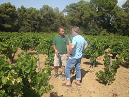 Emmanuel Reynaud and a visitor in the Vineyard